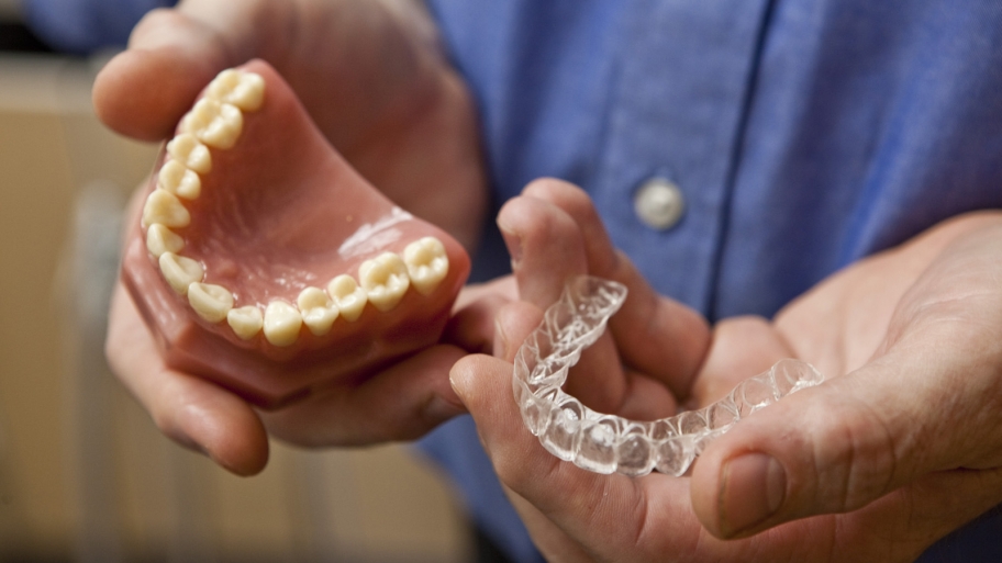 dentist showing invisible braces