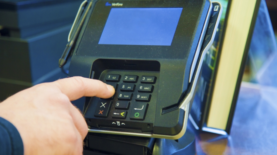man using credit card machine