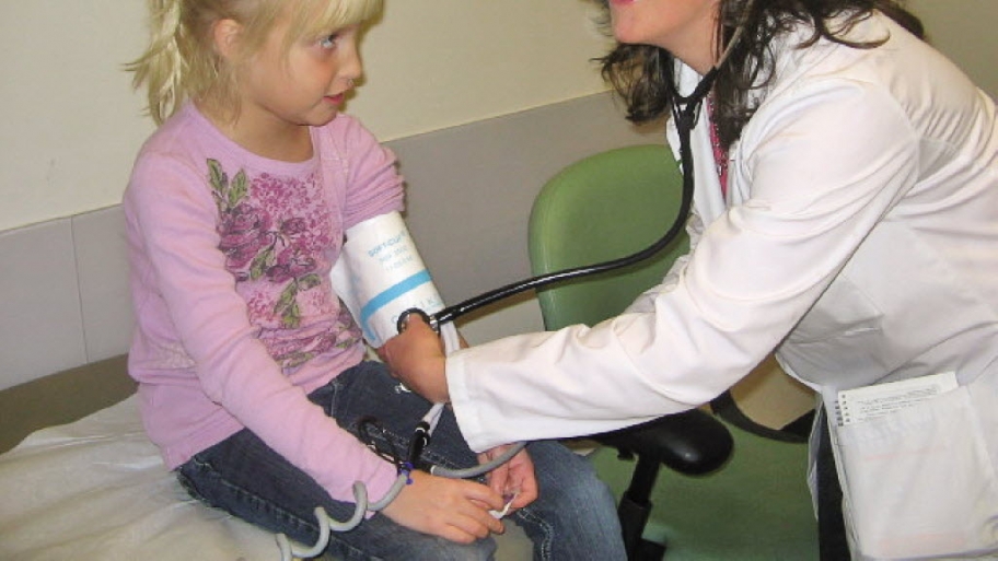 A doctor examines a child