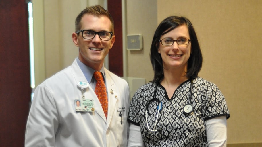 doctor and nurse posing for photo