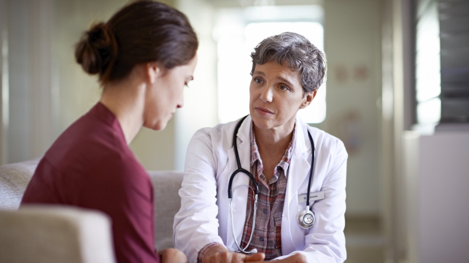 doctor consoles patient