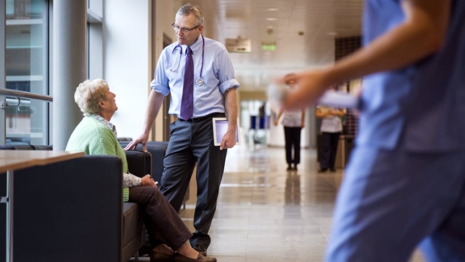 A doctor meets with a patient