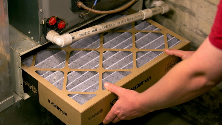 9 Tips For Best A C Performance Angie S List Worker Installing Hvac Filter