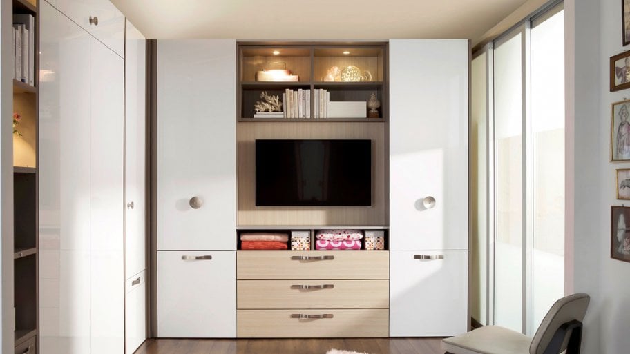 open white cabinet with flat screen TV, side doors and bottom drawers