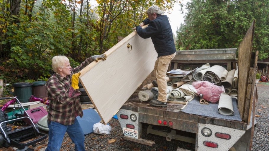 Professional haulers load a truck