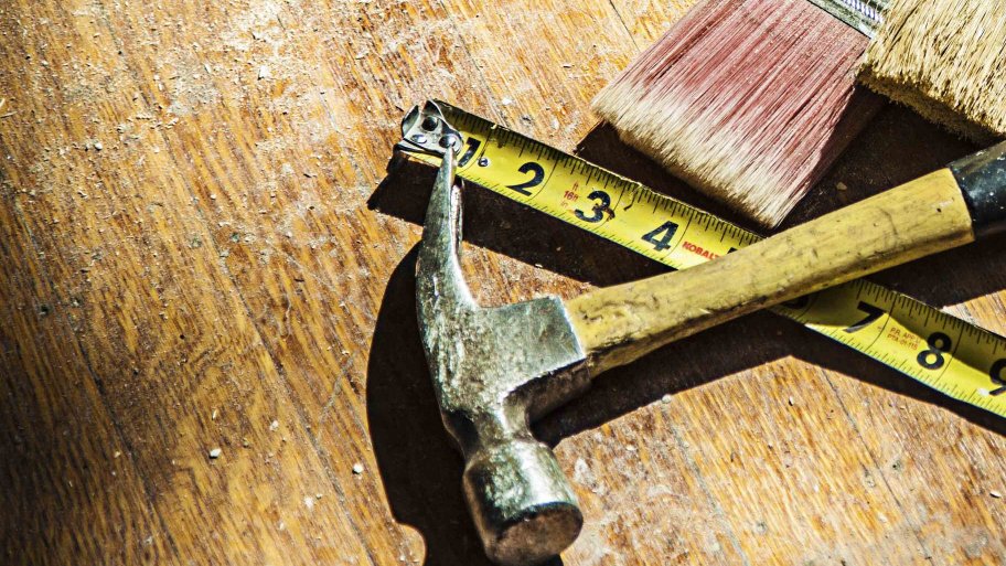 hammer, tape measure, and brush