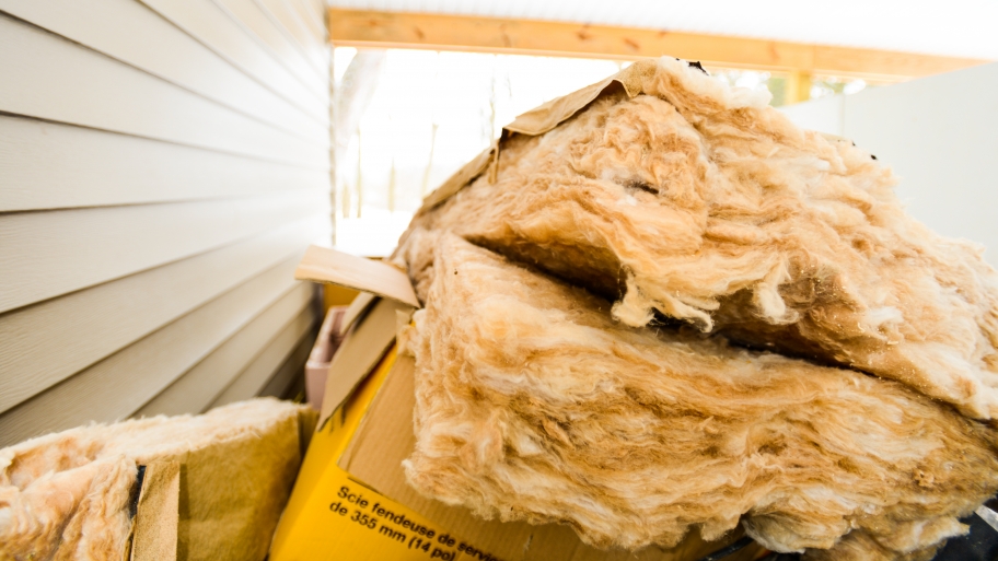 insulation piled outside a home