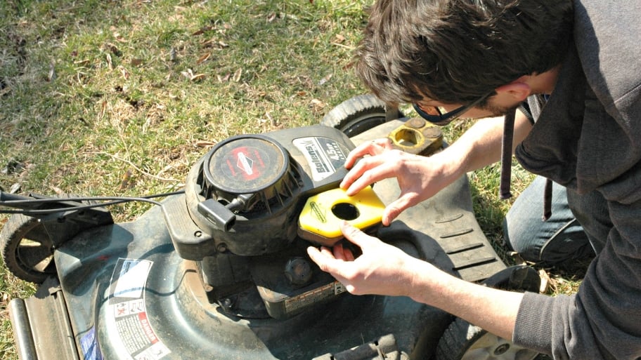 lawn mower being fixed