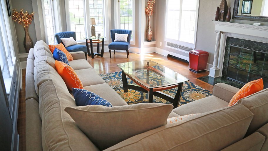 living room couch and seating area by windows