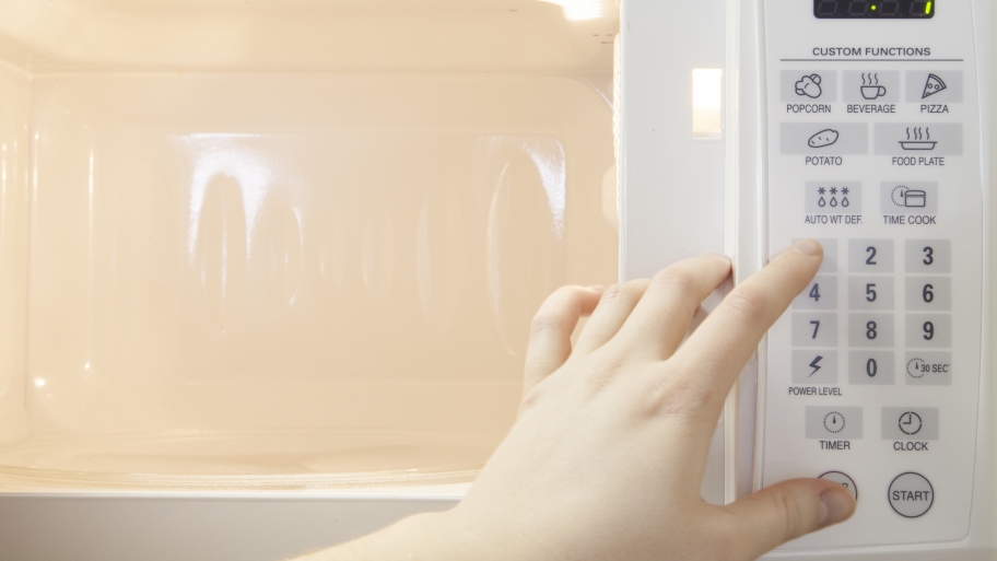 Microwave Repair And What It Costs Angie S List Hand Pushing Ons On A Microwave Oven