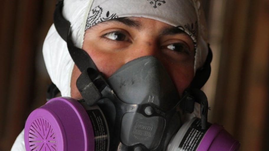 Signs Mold Might Be Growing In Your Home Angie S List A Mold Removal Specialist In Breathing Mask