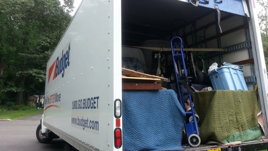 dolly in the back of a full moving truck