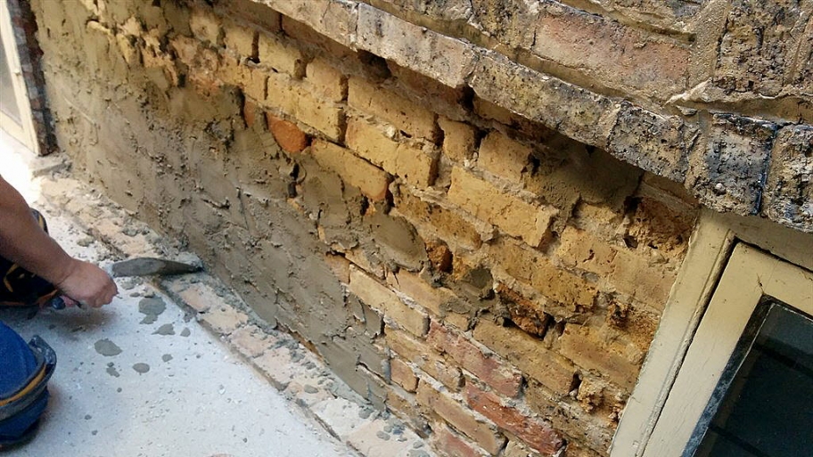 an old brick wall under repair