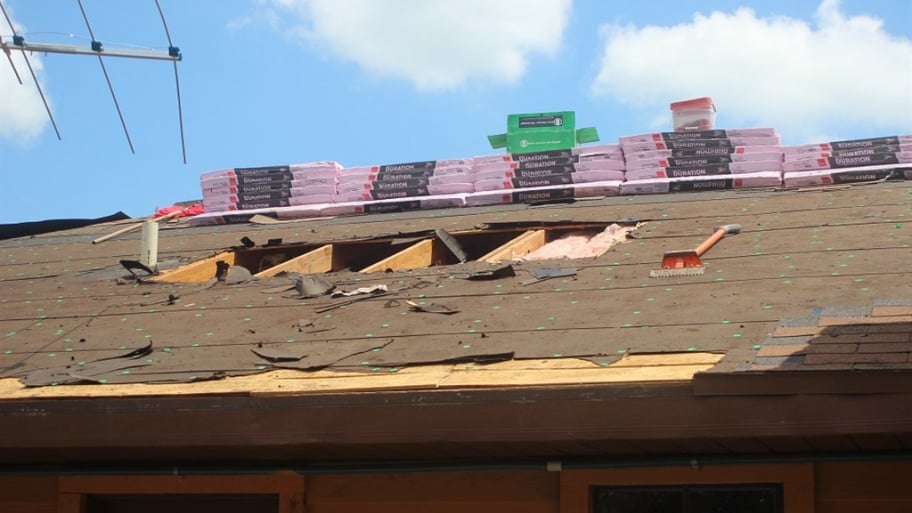 new roofing install on home exposed underlayment