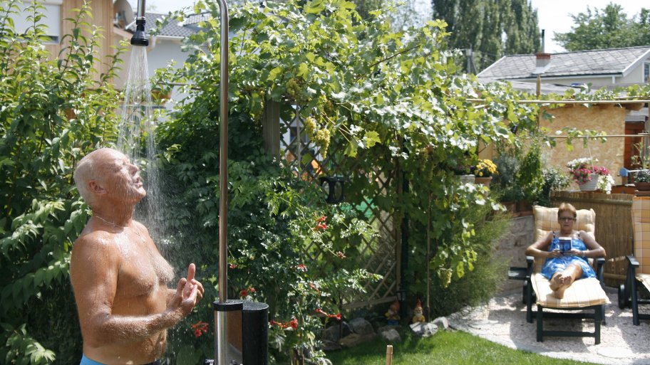 man in outdoor shower