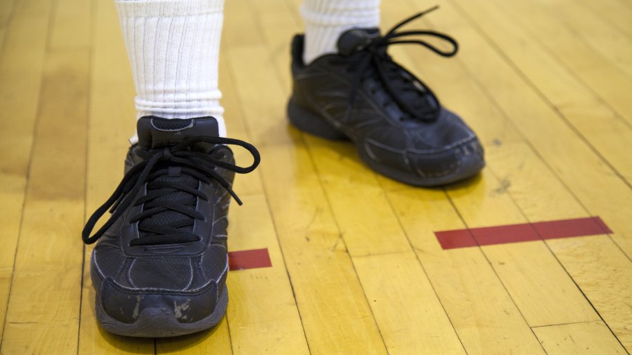 man standing on gymnasium floor