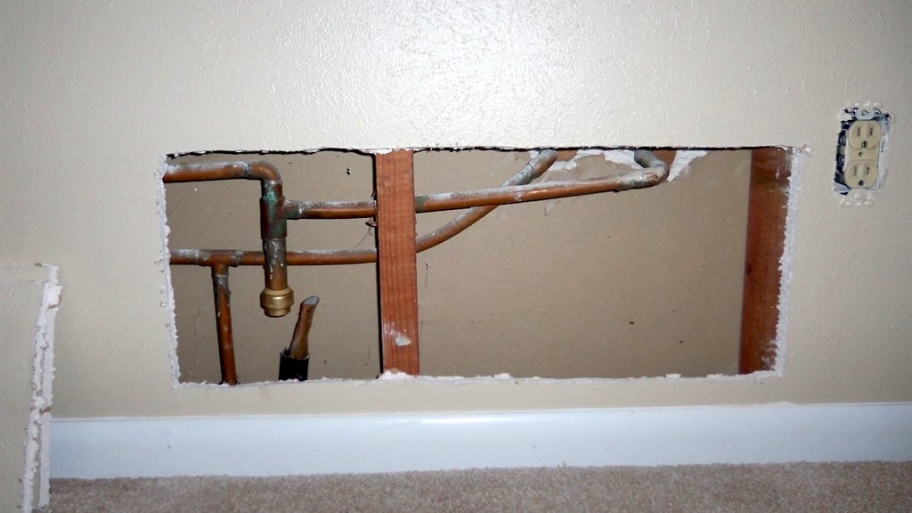 drywall cut out exposed copper water pipes