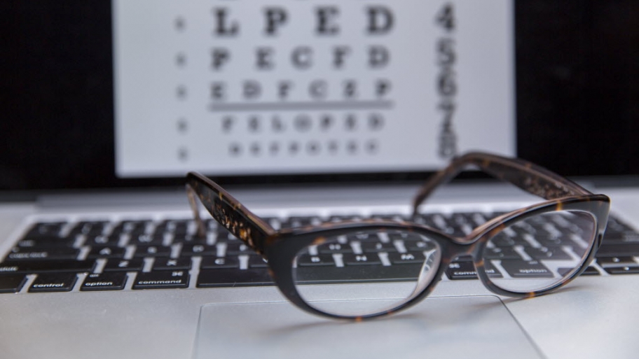 Glasses in front of an eye chart