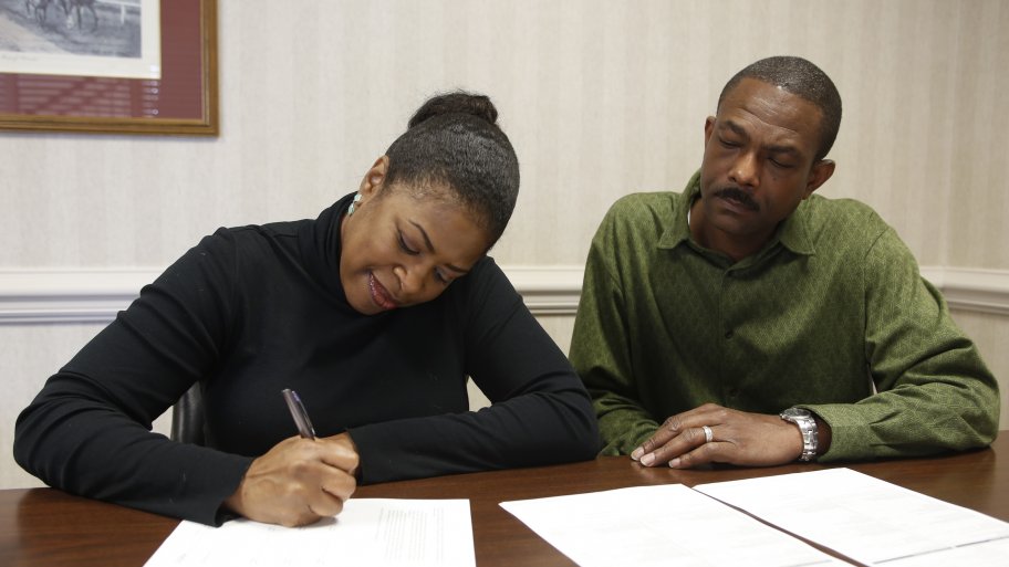 couple signing a notarized document