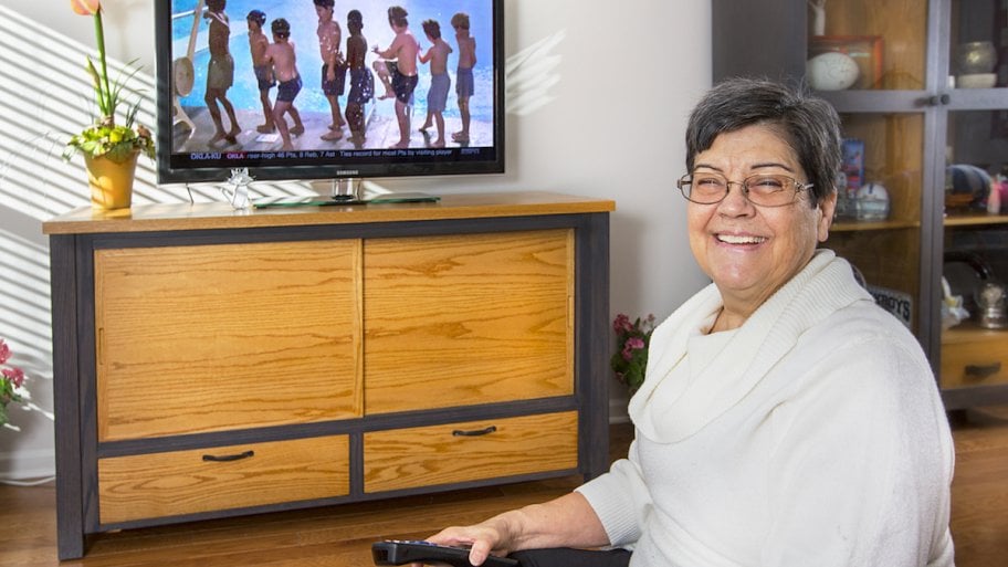 woman with tv and stand