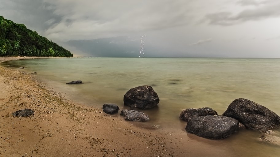 lightning storm on beach photo