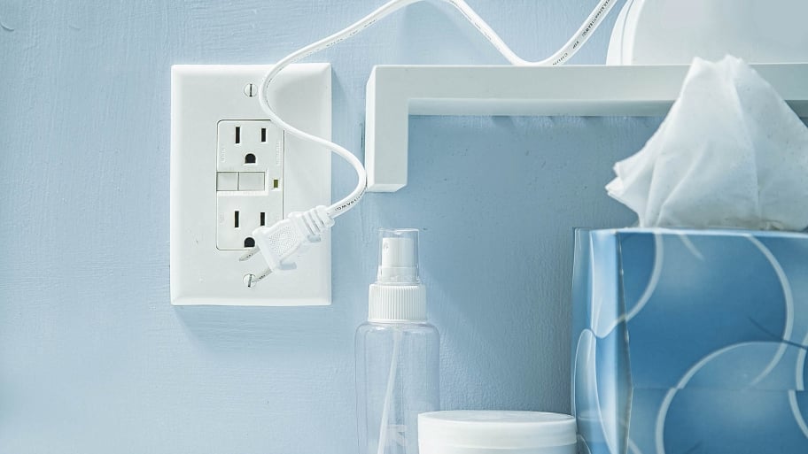 outlet on blue wall