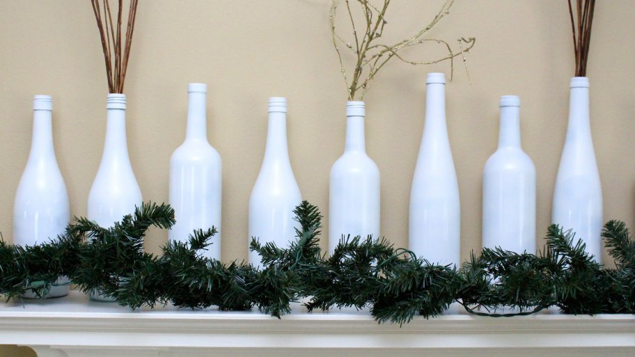 garland and wine bottle decorations on mantel