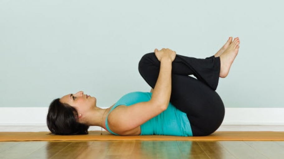 A woman practices yoga