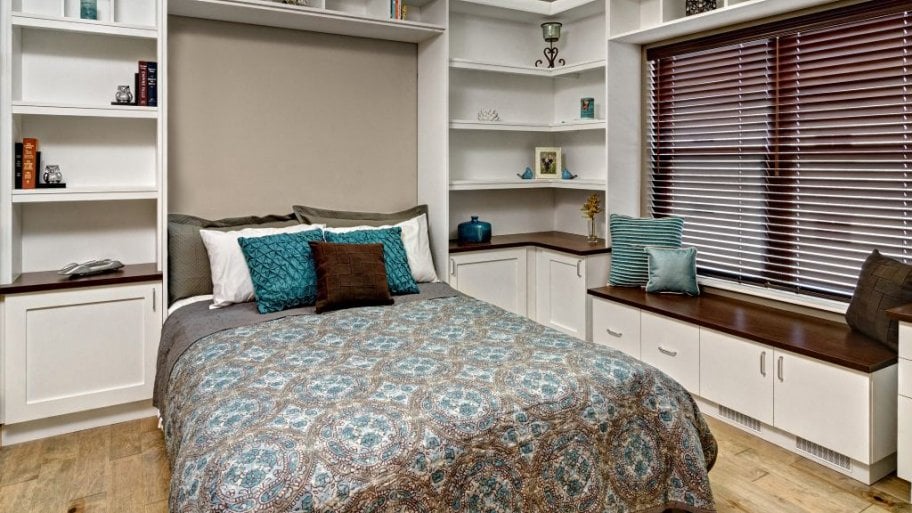 A Murphy bed with built-in shelving