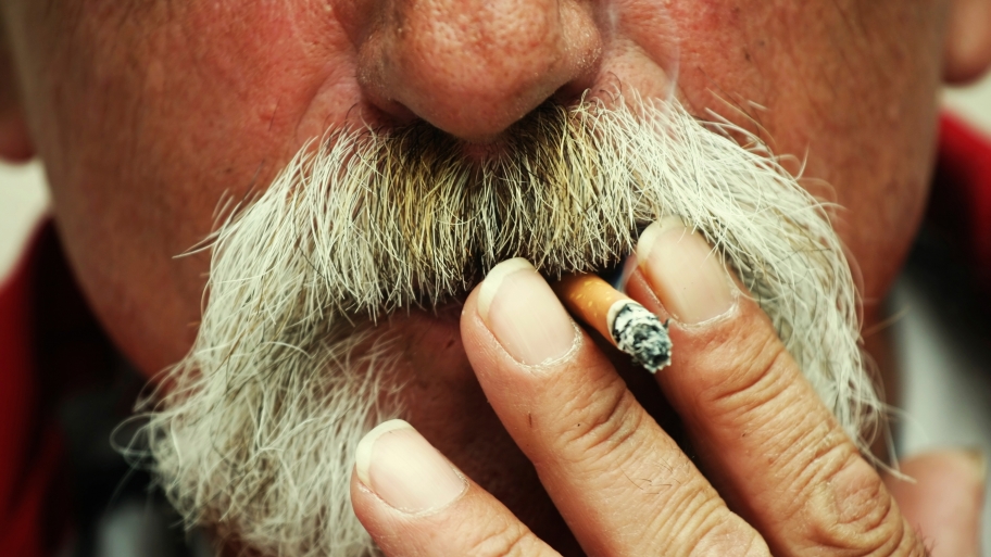 A man smokes a cigarette.