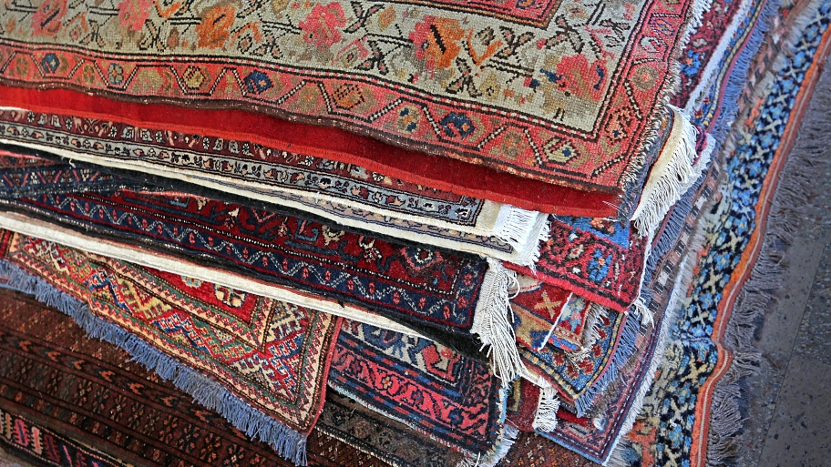 pile of Oriental rugs