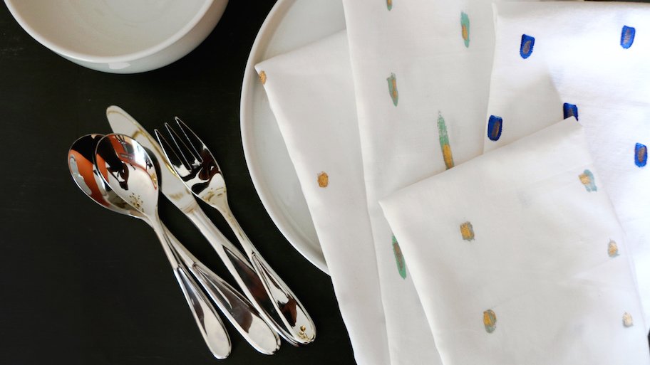 painted cloth napkins at place setting on table