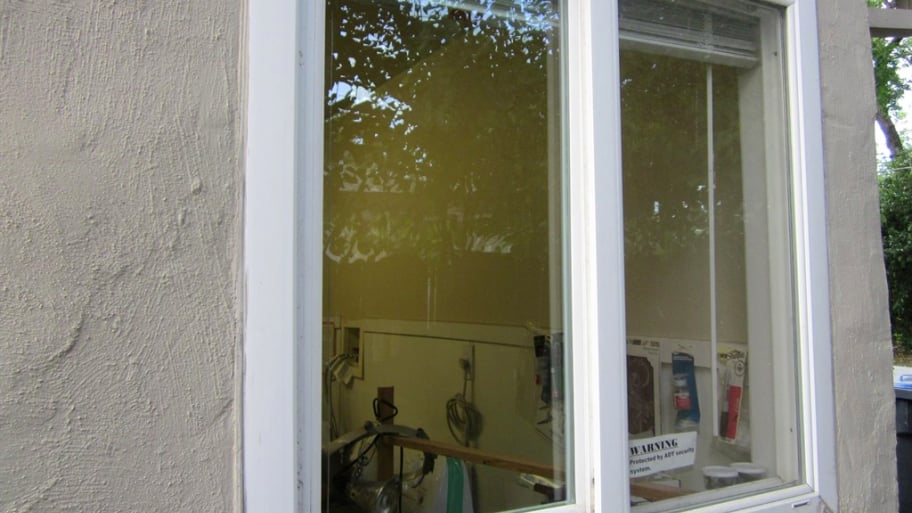 glass in window frame on house