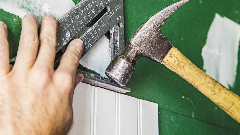 hands using hammer and triangle tool