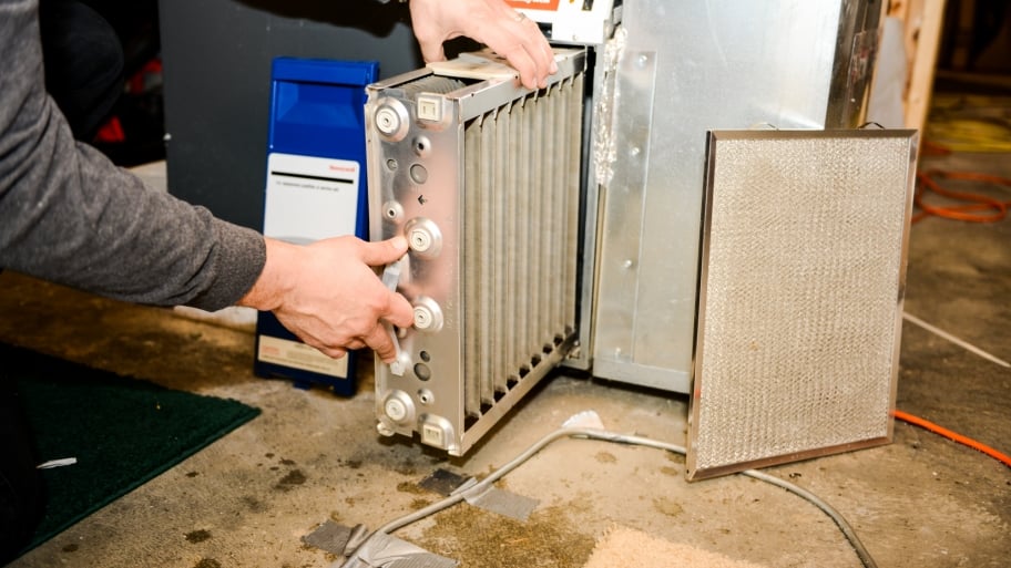 Fight Allergies At Home With Cleaning Air Filters Angie S List Air Filter Being Changed