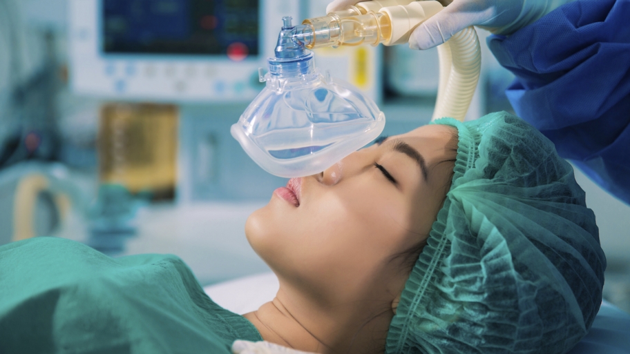 anesthesia mask and woman patient