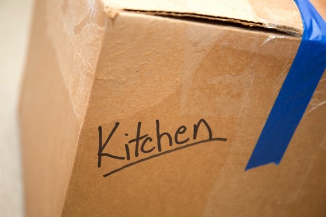 a cardboard box with blue packing tape