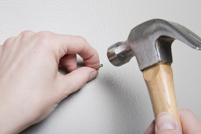How to hang a picture (Photo by Eldon Lindsay)