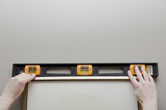 How to hang a picture (Photo by Eldon Lindsay)