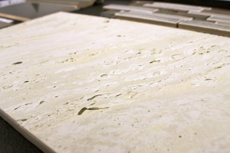porcelain tile styled as a faux travertine tile