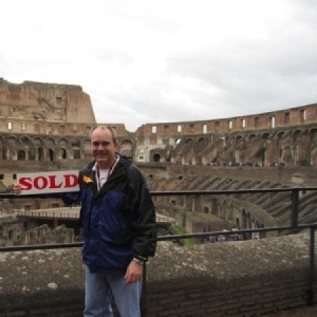 Realtor with sold sign