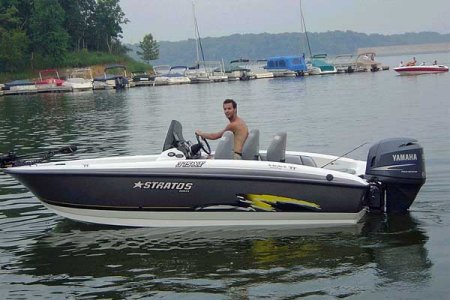 man driving boat on lake