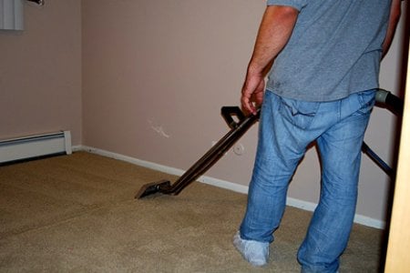 man carpet cleaning