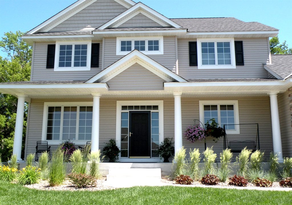 home exterior with front porch and columns
