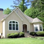 home with neatly landscaped yard