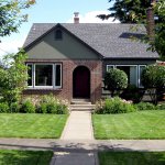 home exterior with neatly landscaped yard