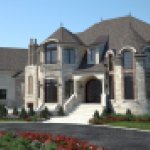 house exterior with resurfaced driveway