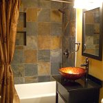 bathroom remodel with tile shower and floor
