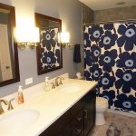 bathroom remodel with long vanity and tiled shower