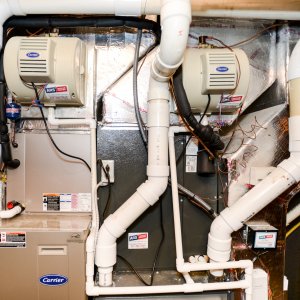 What causes a furnace to smell like oil when turned on?